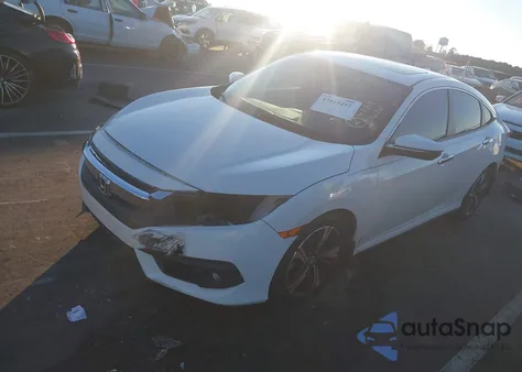 2017 Honda Civic Touring z USA, uszkodzony, nr VIN 2HGFC1F93HH648647